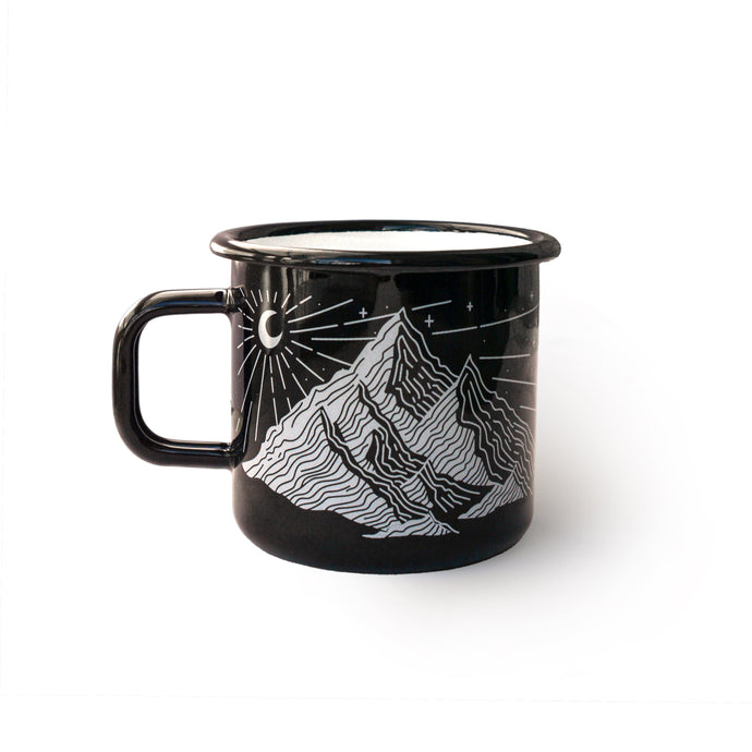 Black mug with mountain design on a white background