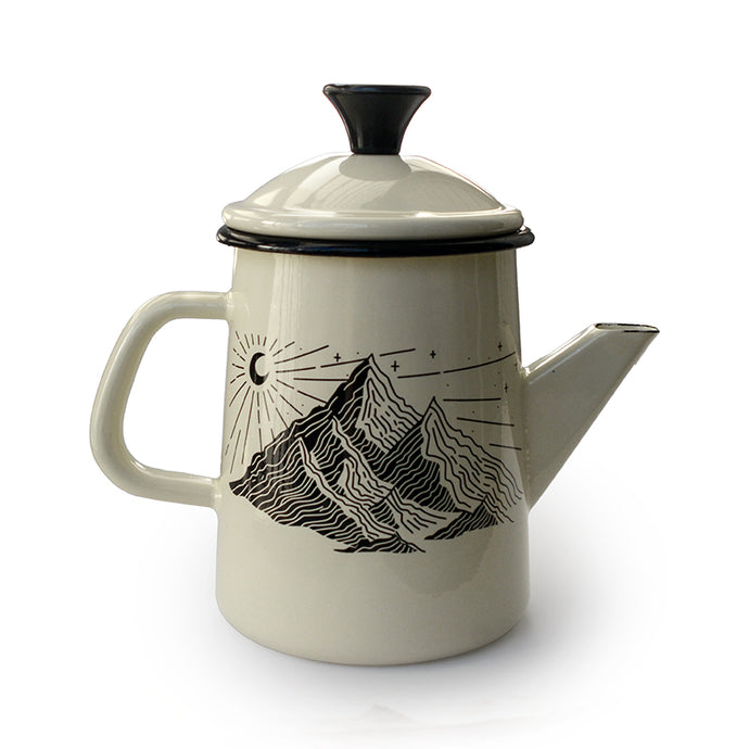 Teapot with mountain design on a white background