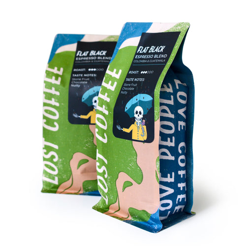 Two coffee bags with colorful designs and text on a white background
